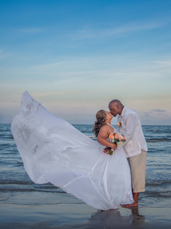 Everlasting Elopements couple kissing on the beach in the water at North Padre Island