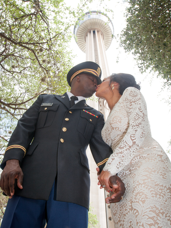 Everlasting Elopements couple kissing in front of the tower at Fountain At The Tower Of The Americas