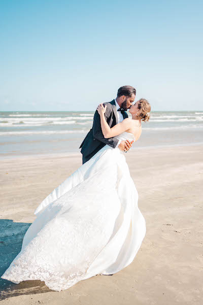 DaniLea Photo couple kissing on beach