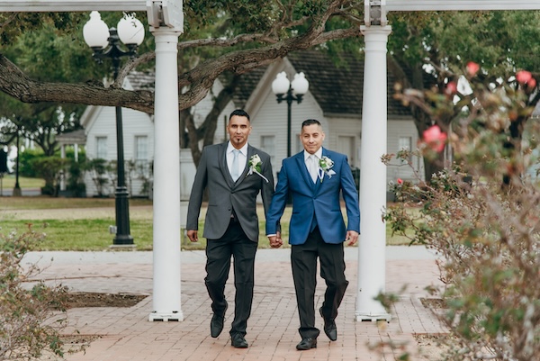 Everlasting Elopements same sex couple walking into wedding ceremony at Lytton Memorial